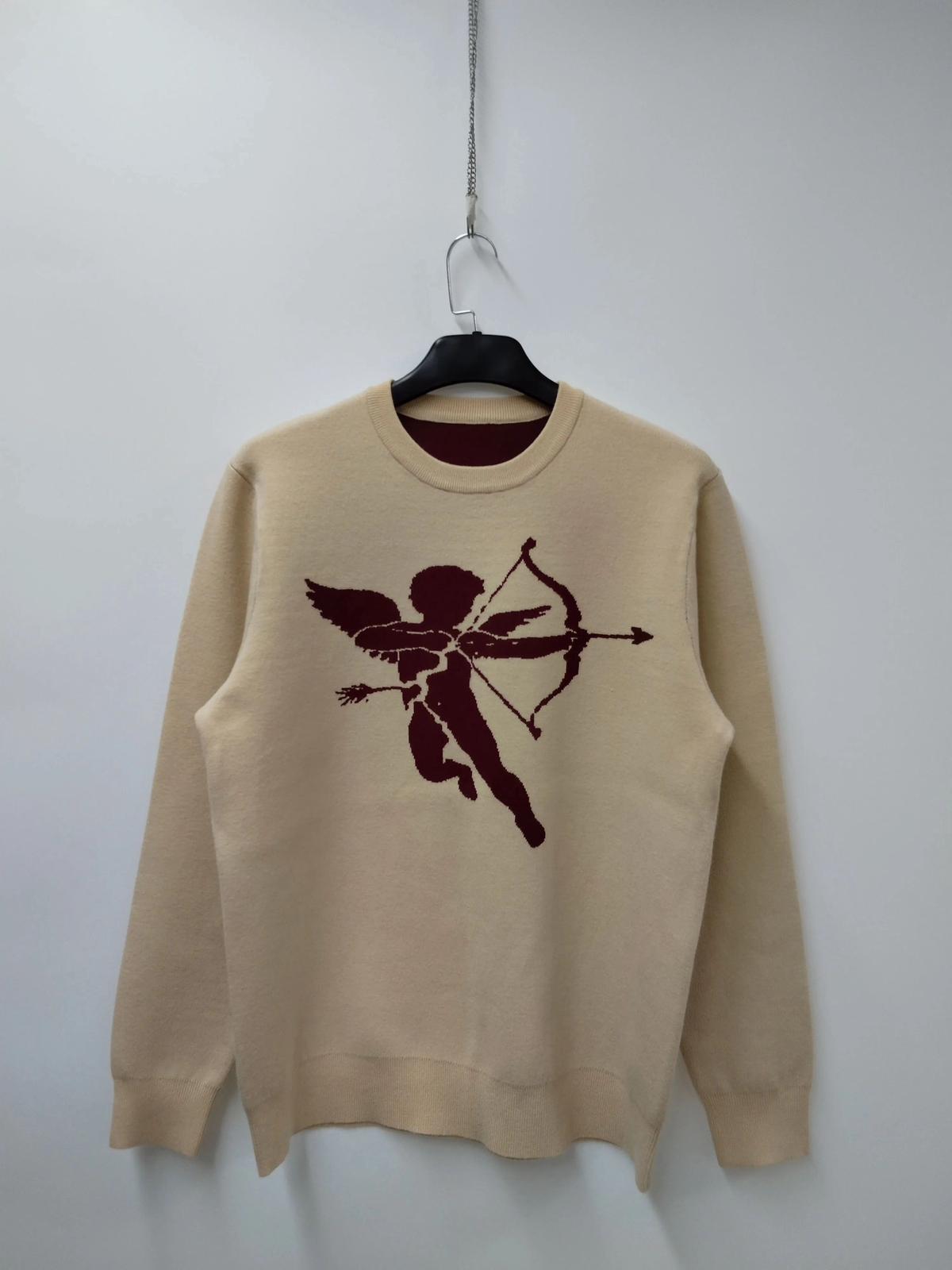 jersey rompido cupido en beige con un cupido en color granate